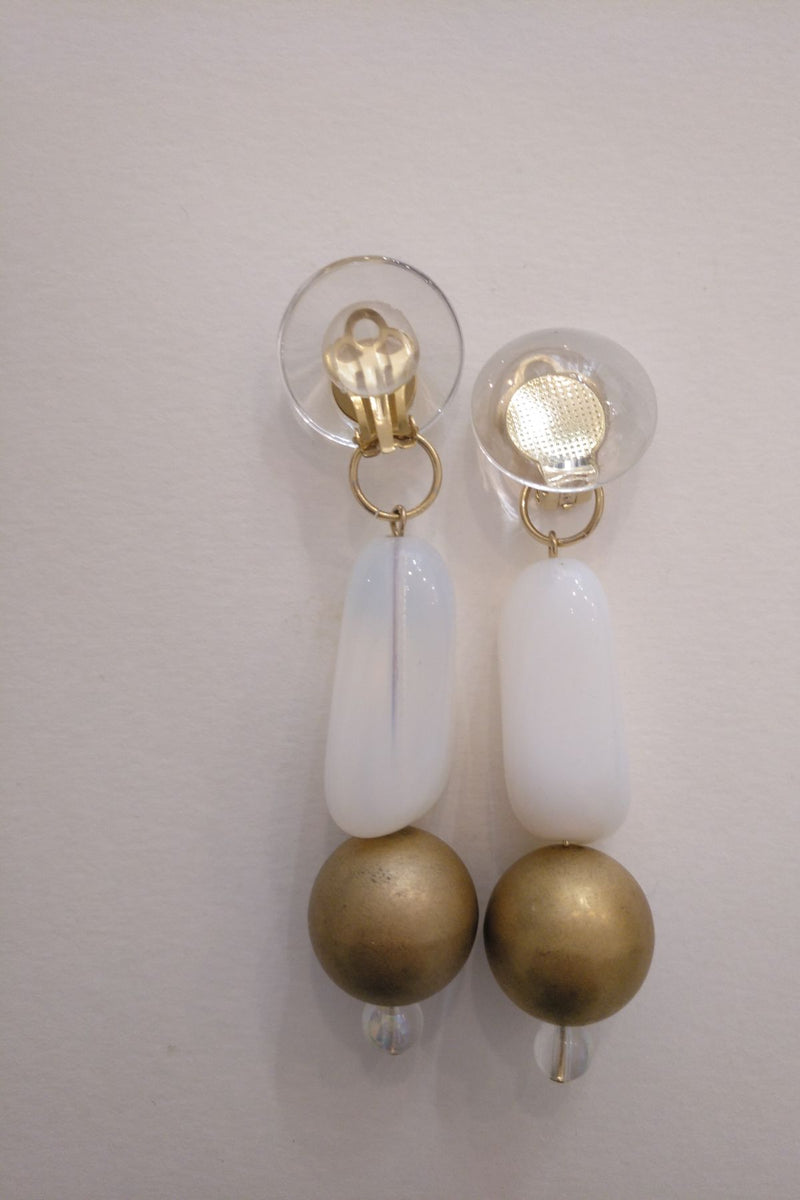 Golden and White stones long clip earrings by Yuumi Peralta